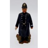 A painted metal cast model policeman novelty inkwell - the lid jammed, 12cm tall