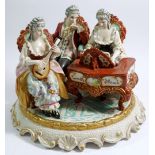 A large Spanish porcelain group of musicians, 22 x 26cm