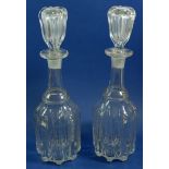 A pair of 19th century glass ribbed decanters and stoppers
