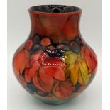 A Moorcroft vase in the leaves and fruit design with William Moorcroft monogram, 21cm tall