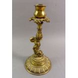 A 19th century cast brass dolphin candlestick, 22cm tall