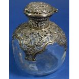 A Victorian glass scent bottle with pierced silver lid, collar and overaly