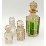 A collection of four 19th century glass painted scent bottles