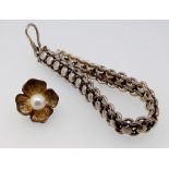 A silver flower form pendant set pearl and a Indian silver bracelet, total weight 31.9g