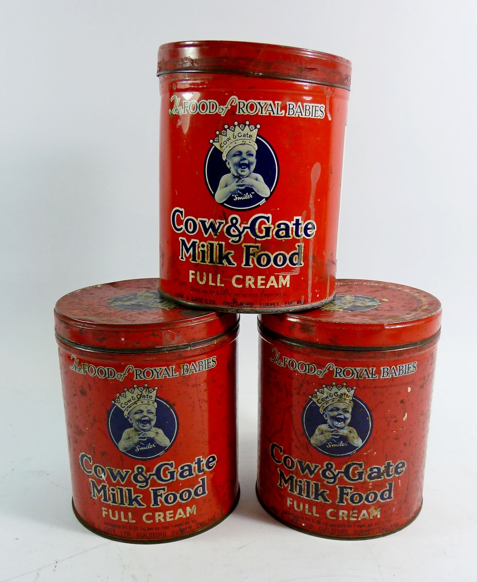 Three vintage Cow & Gate milk tins