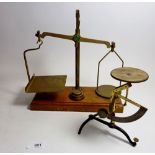A pair of Avery brass and mahogany postal balance scales and another pair of postal scales