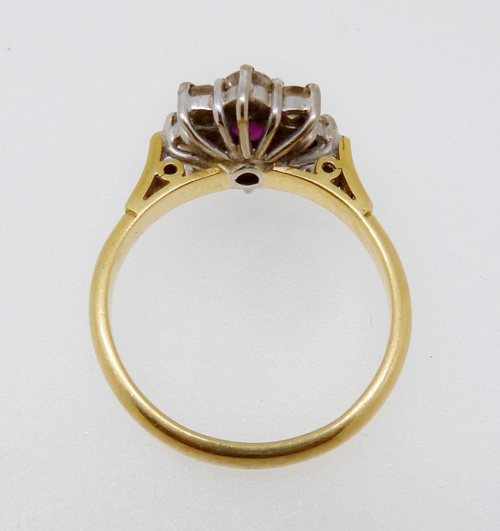 An 18ct gold ruby and diamond cluster ring, size N - Image 4 of 4