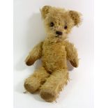 An early 20th century gold mohair teddy bear, 32cm