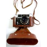 A vintage FED 4 camera in leather case