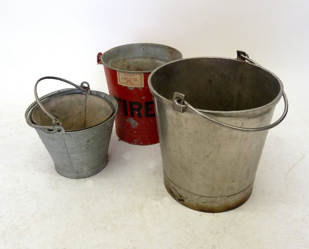 A vintage fire bucket and various old galvanised buckets