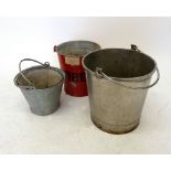 A vintage fire bucket and various old galvanised buckets