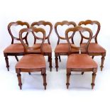 A set of six of Victorian triple balloon back dining chairs on turned supports