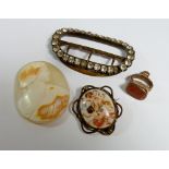 A group of antique jewellery including a Georgian paste buckle, a Victorian carved cameo, a yellow