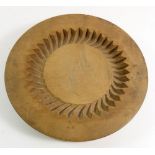 A carved wooden pastry mould, 17cm diameter