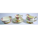 A Paragon tea service painted and printed fox gloves comprising: twelve cups and saucers, twelve tea