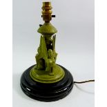 A green painted Art Deco Egyptian style table lamp with triple sphinx decoration to stem