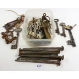 A box of large iron nails and keys etc