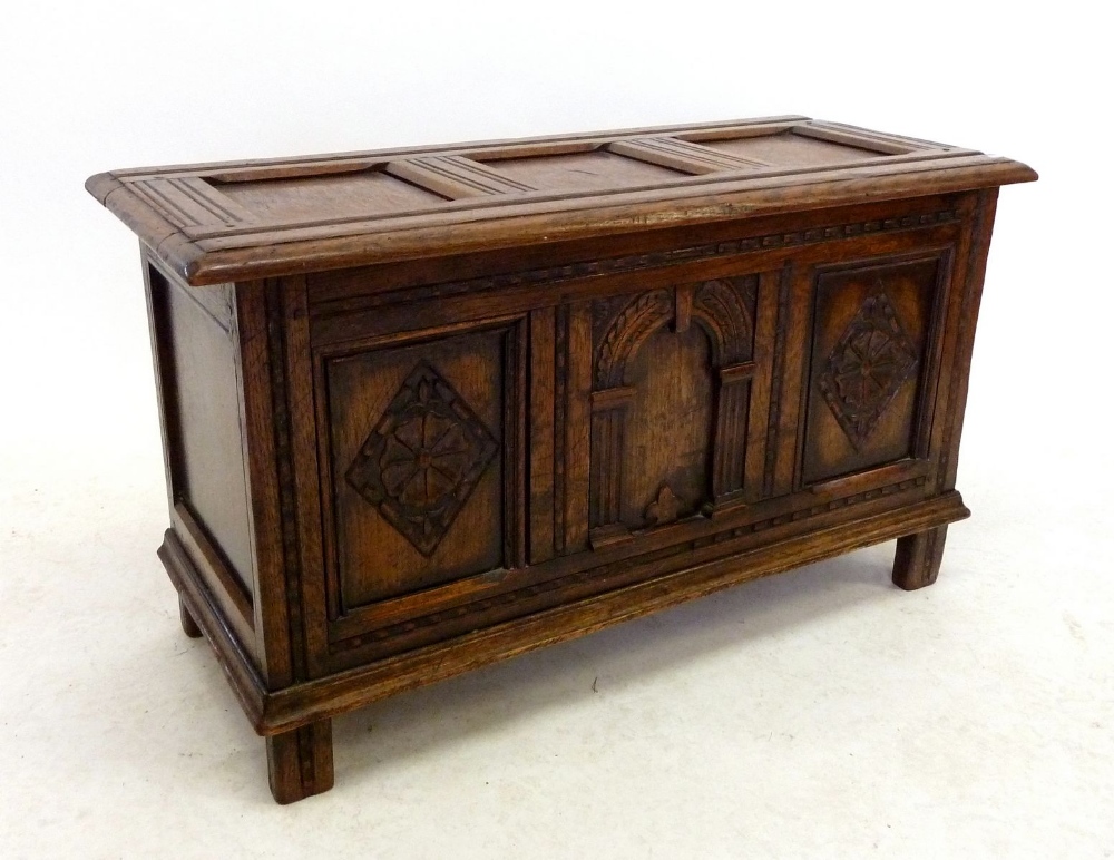 A small oak panelled coffer, 90cm wide