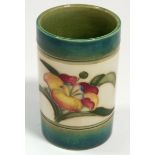 A Moorcroft spill vase painted Hibiscus on cream ground with green borders, 7.5cm tall