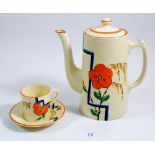 A Wilkinson's Art Deco Honey Glaze coffee set decorated in the style of Clarice Cliff with orange