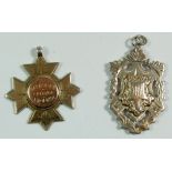 A silver and 9ct gold sports fob 1895 by Vaughnon & Sons and a silver one, 1913 by Robert