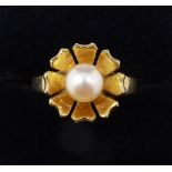 A 9 carat gold ring set pearl in flower form surround, size L to M, 3.1g