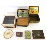 A box of assorted vintage tins including Blue Bird toffee and Huntley & Palmers