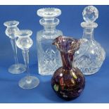Two cut glass decanters, a pair of candlesticks and an Italian Millefiori glass jug
