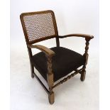 A 1930's cane back nursing chair