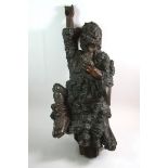 A large Chinese root carving of a man with one arm raised, 61cm