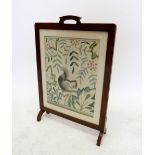 An oak framed firescreen with embroidered squirrel