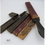 Four cut throat razors and a seal skin strop