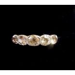 An Edwardian 18 carat gold ring set five diamonds, size J