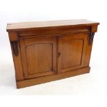 A Victorian mahogany credenza with frieze drawer over pair of arch panelled cupboards - top missing,