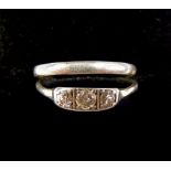A platinum three stone diamond ring, size M, 1.8g and a platinum wedding band, size N/O, 3.5g