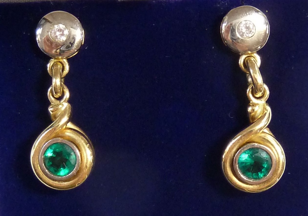 A pair of 14k gold pendant earrings set emeralds and diamonds, total weight 13g, 3cm long