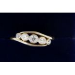 An 18 carat gold ring crossover set five diamonds, 2.4g, size L