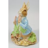 A Peter Rabbit musical figure by Schmidt, 17cm