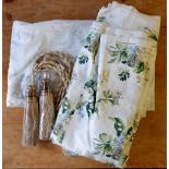 A large roll of Laura Ashley floral curtain fabric in green and ivory, approx 30 metres with two tie