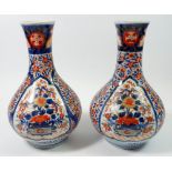 A pair of late 19th century Japanese Imari bulbous vases, 24cm tall