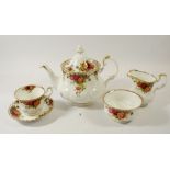A Royal Albert tea service comprising: thirteen cups, twelve saucers, eleven tea plates, mil jug,