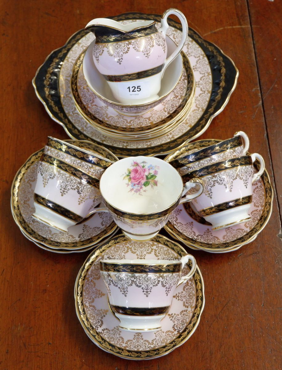 An Imperial part floral tea service comprising: six cups and saucers, six tea plates, cake plate,