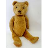 A large gold plush jointed teddy bear, 66cm