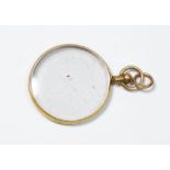 A gold framed magnifying glass