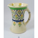 A Royal Doulton 1930's Art Deco jug painted yellow flowers in blue trellis, 20cm