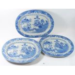 A group of three Chinese Qing Dynasty blue and white meat plates painted landscapes, largest 41 x