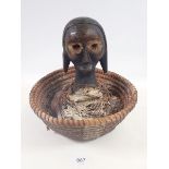 A Karabon tribal reliquary figure and basket