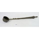 An Islamic metal ladle engraved with decorative text