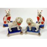 A pair of Staffordshire style lions and a pair of cats, 8cm tall