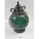 A green glass Moroccan style lantern - 26cm tall